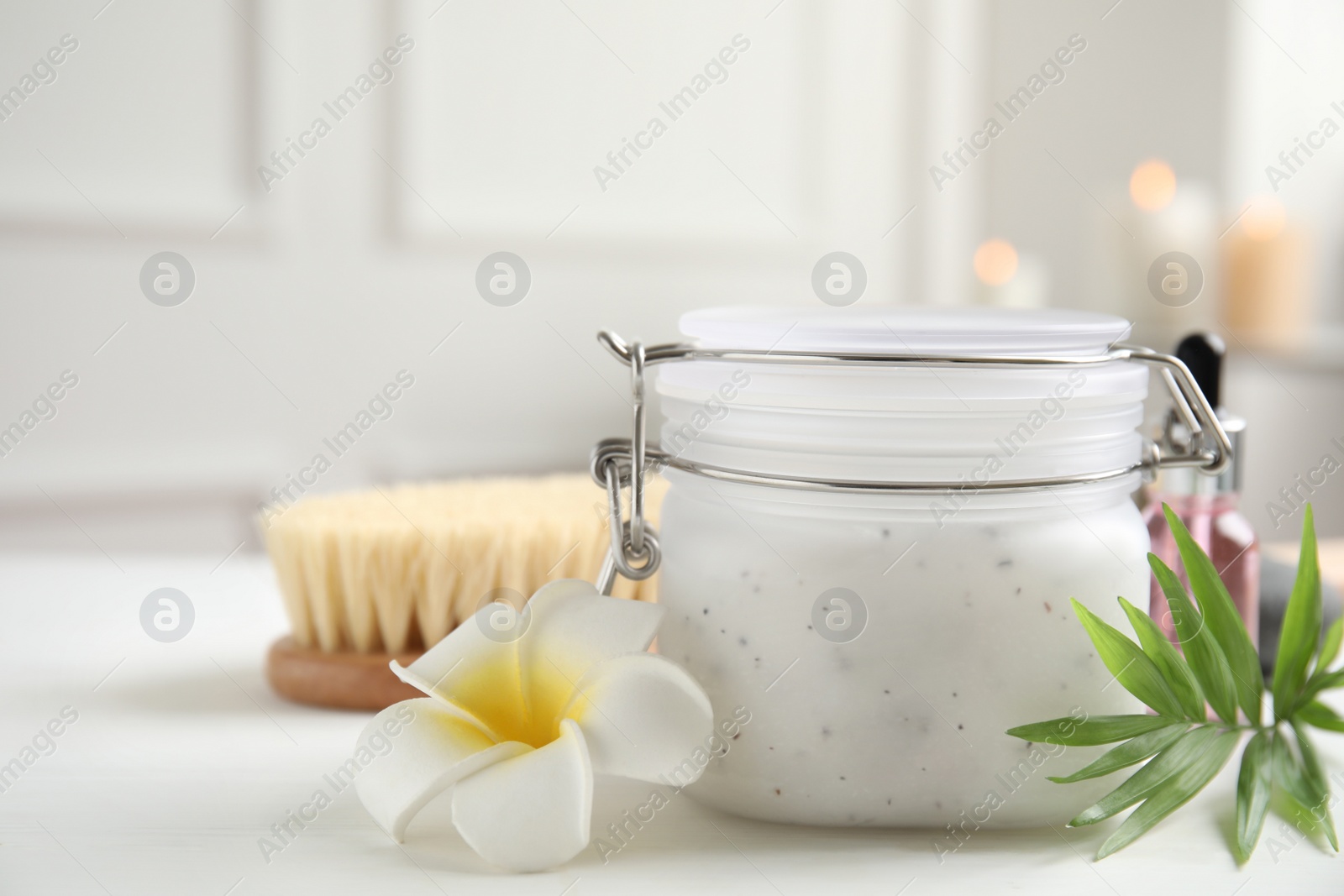 Photo of Composition with salt scrub on white table. Space for text