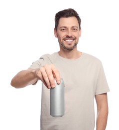 Photo of Happy man holding tin can with beverage on white background