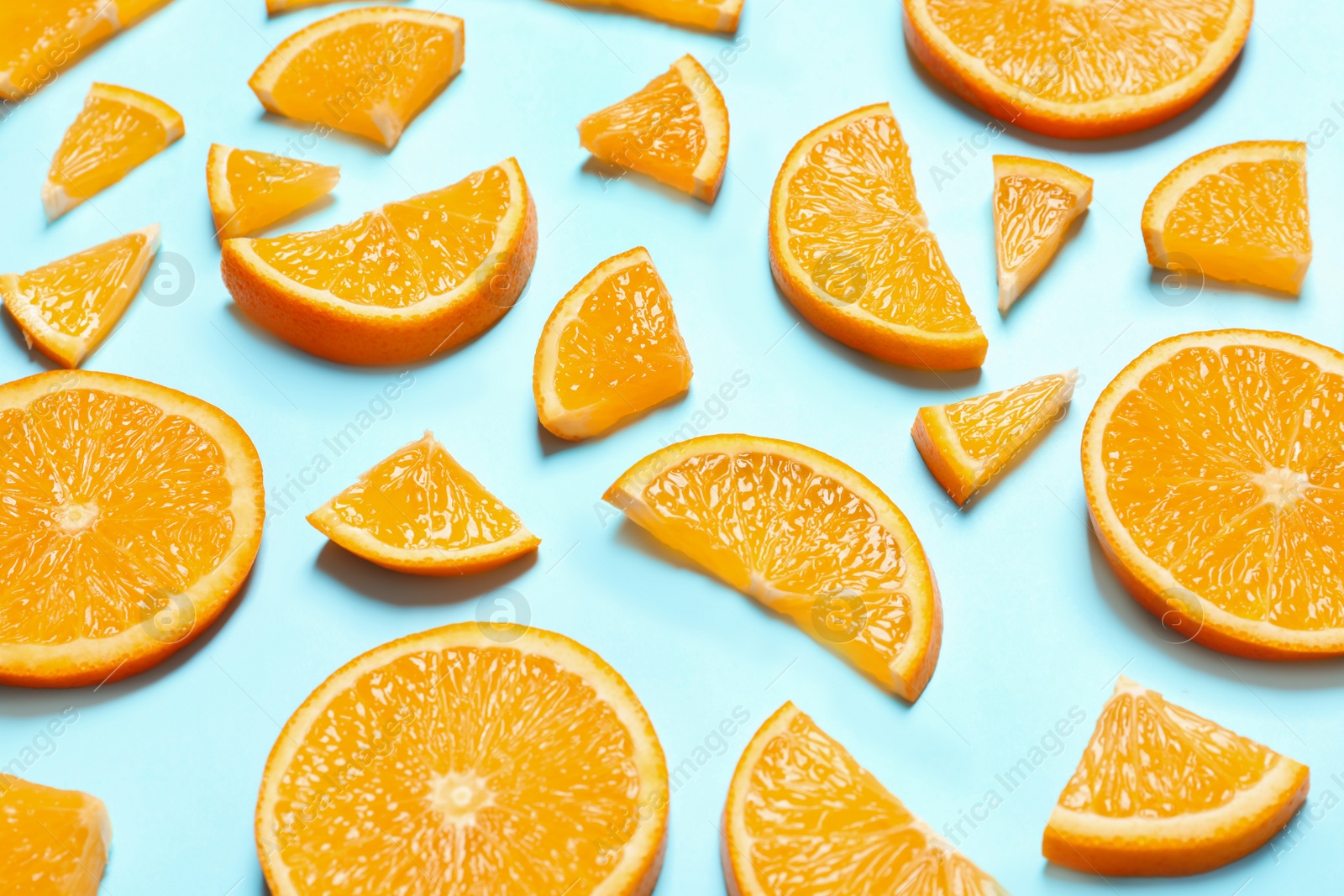 Photo of Composition with orange slices on color background