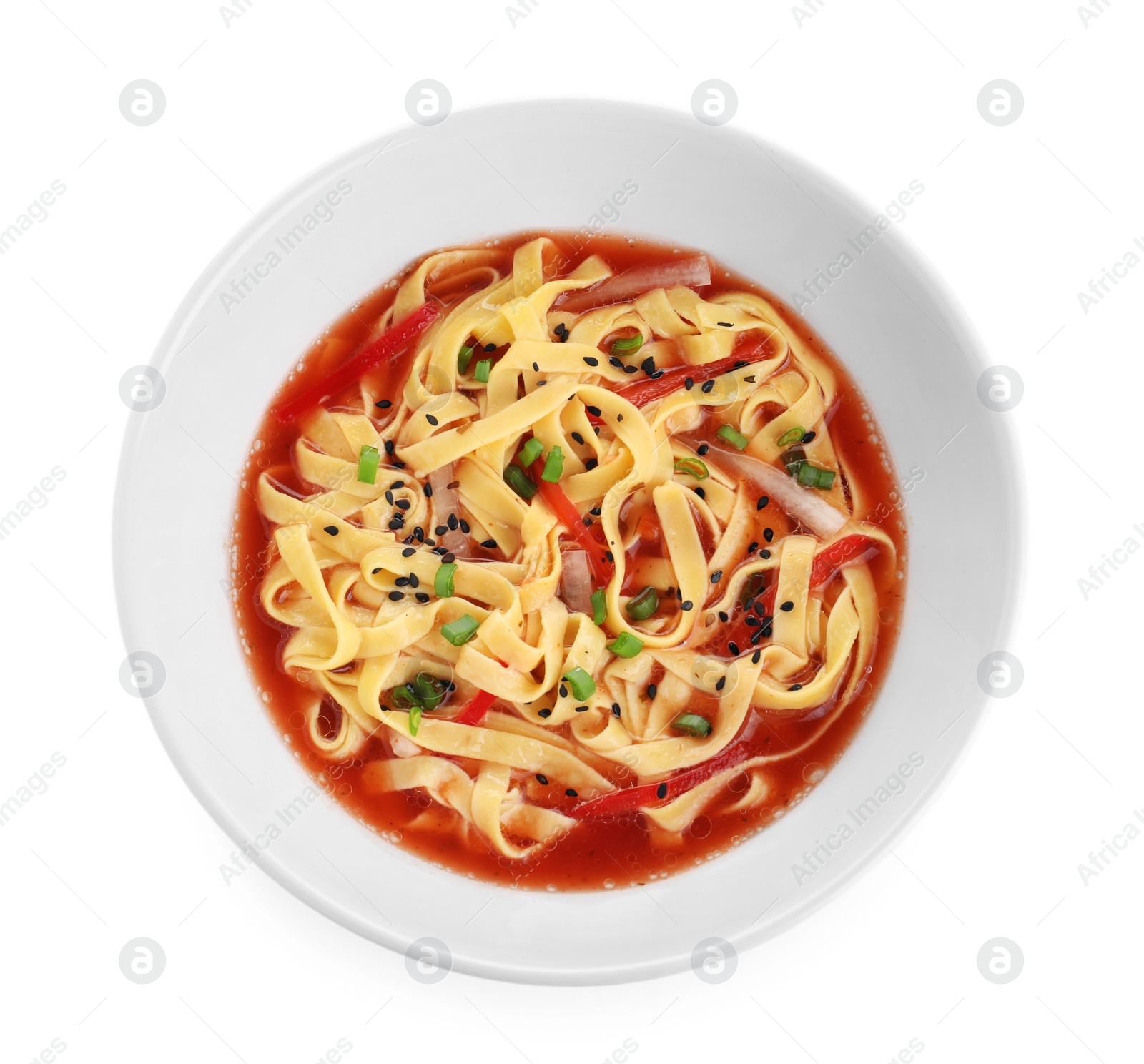 Photo of Plate of asian noodles with broth and vegetables isolated on white, top view