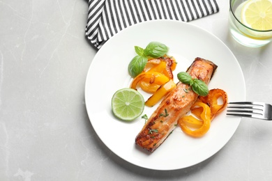 Photo of Tasty cooked salmon served for dinner, top view