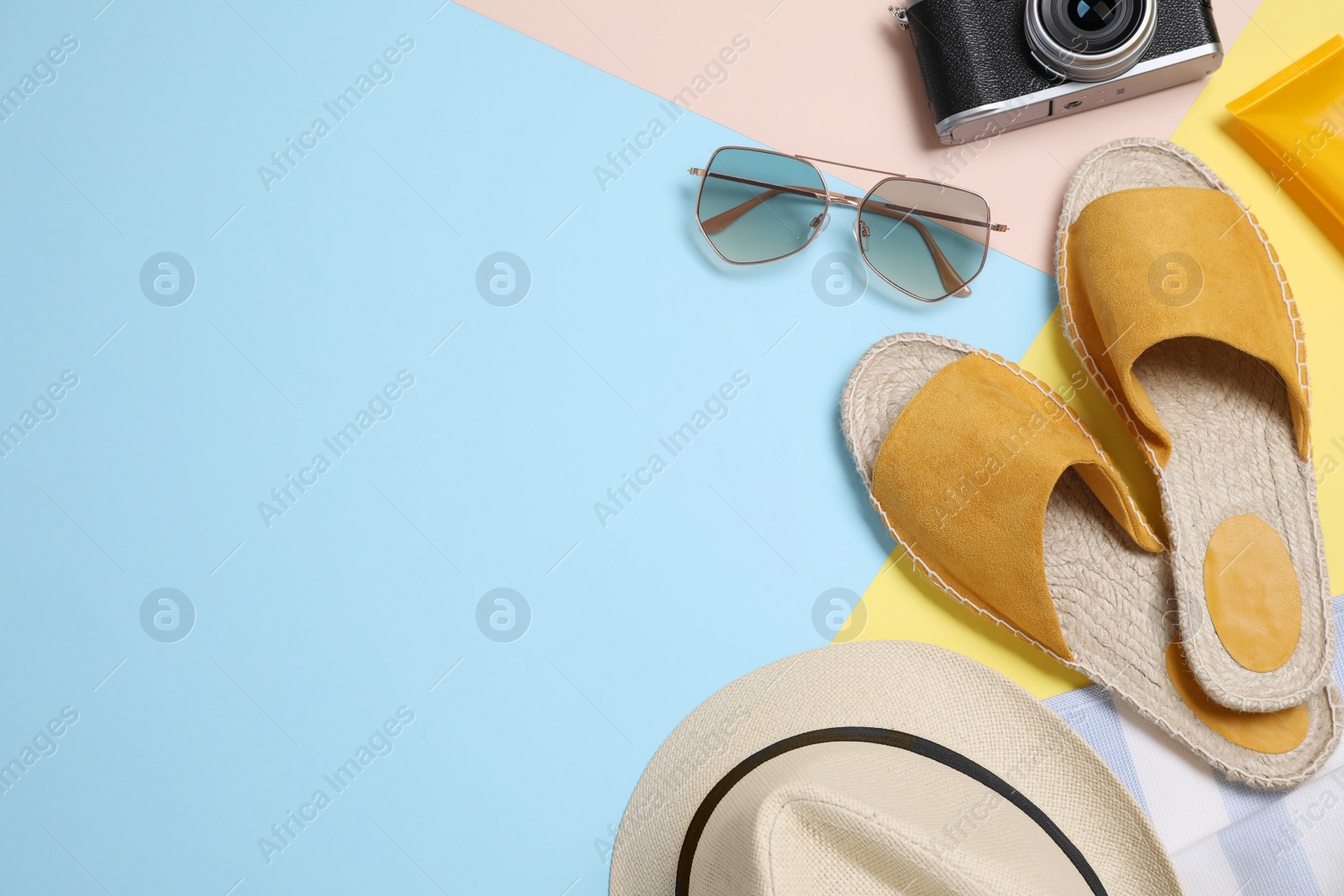 Photo of Flat lay composition with beach objects on color background. Space for text