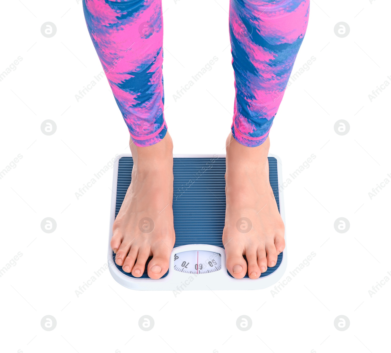 Photo of Young woman measuring her weight using scales on white background. Weight loss motivation