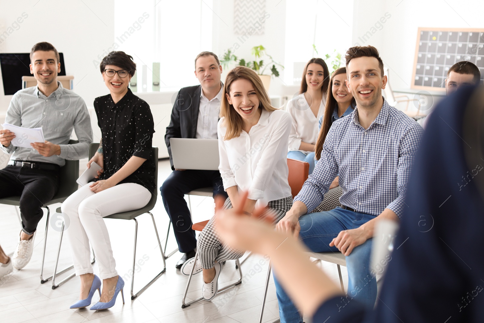 Photo of Young people having business training in office