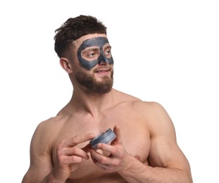 Photo of Handsome man with clay mask on his face against white background