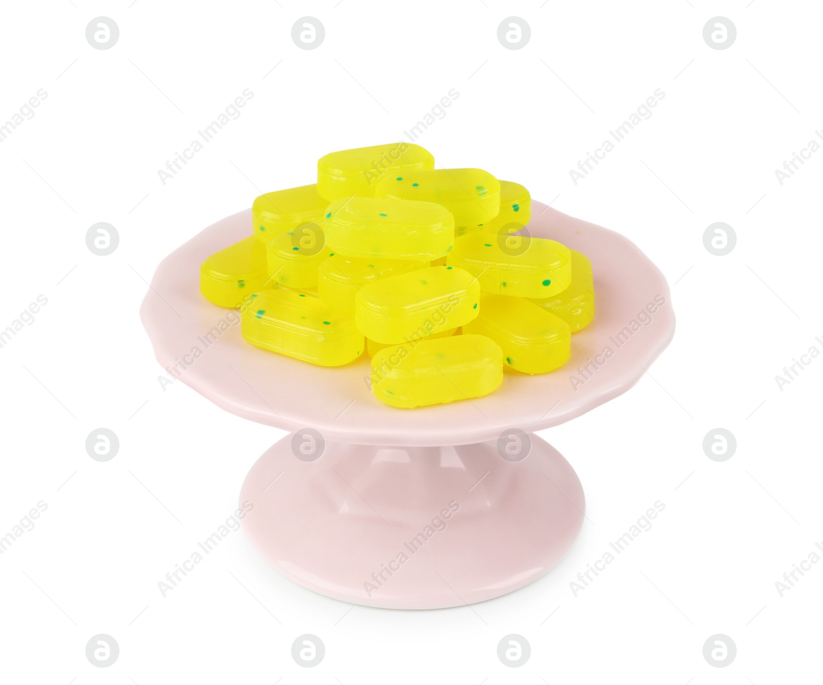 Photo of Tasty small lemon drops on white background