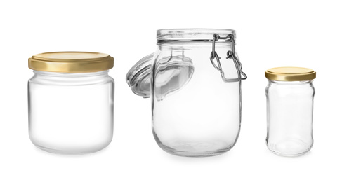 Image of Set with different empty glass jars on white background