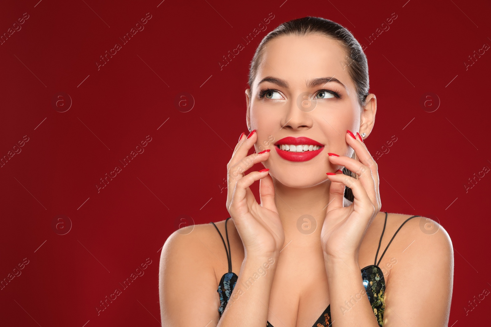 Photo of Portrait of beautiful young woman with bright manicure on color background, space for text. Nail polish trends