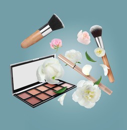 Spring flowers and makeup products in air on background