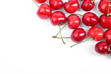 Heap of ripe sweet cherries on white background, top view