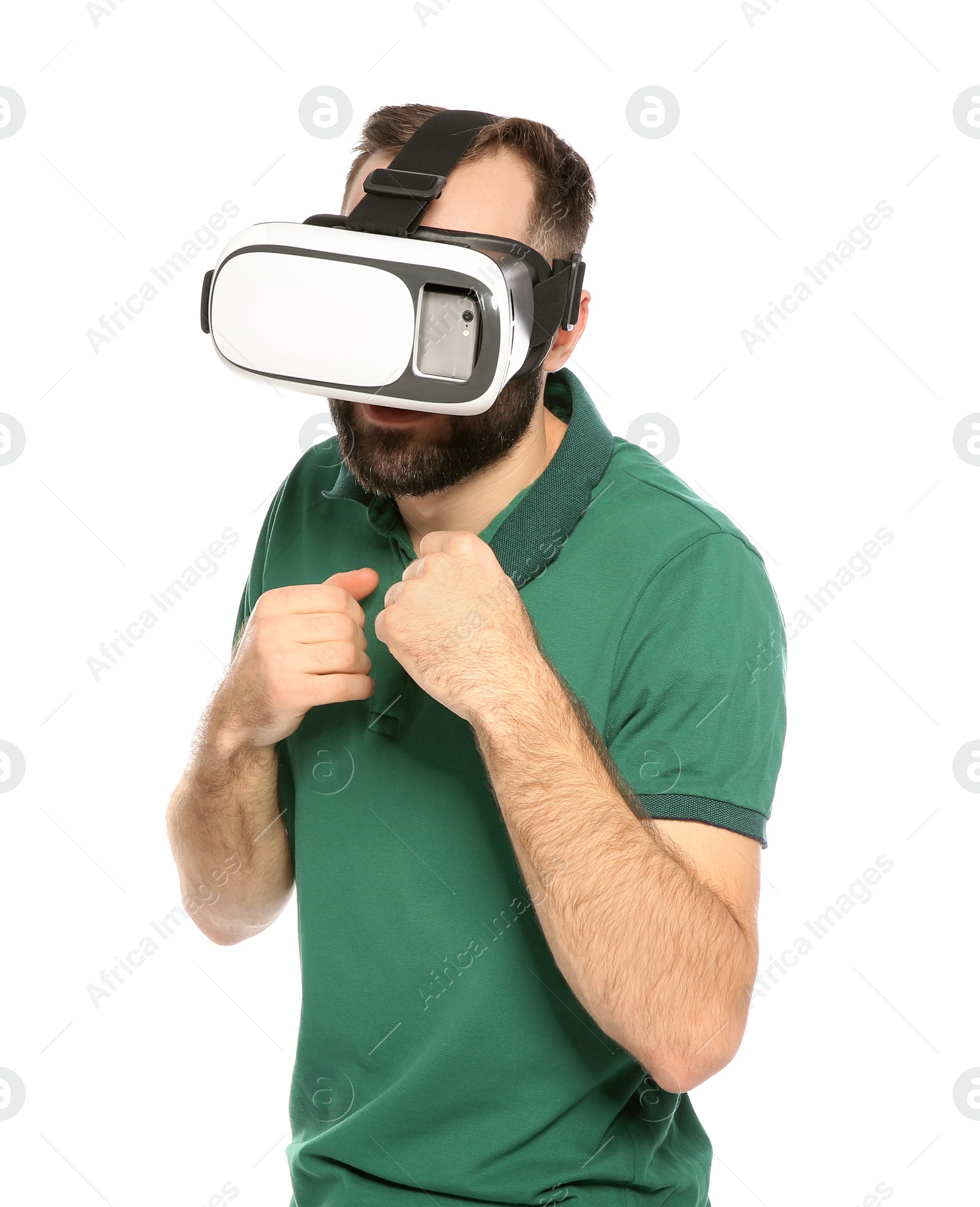 Photo of Emotional young man playing video games with virtual reality headset isolated on white