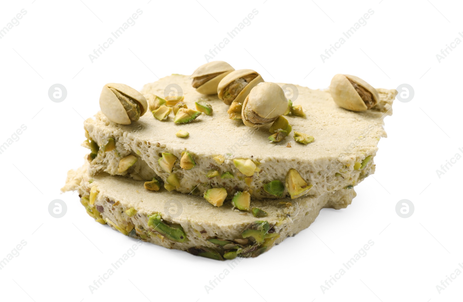 Photo of Pieces of tasty halva with pistachios on white background