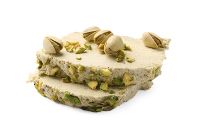 Photo of Pieces of tasty halva with pistachios on white background