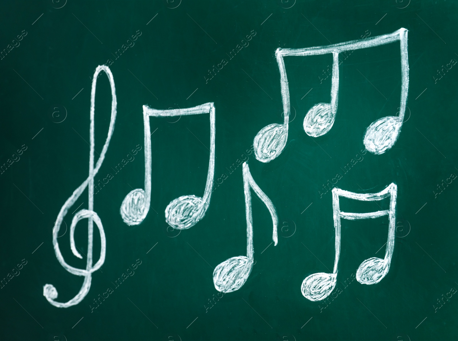 Photo of Treble clef and music notes on chalkboard