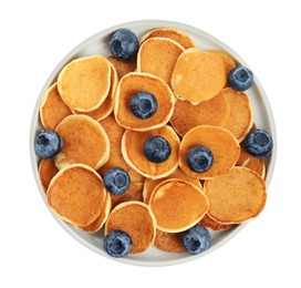 Delicious mini pancakes cereal with blueberries on white background, top view