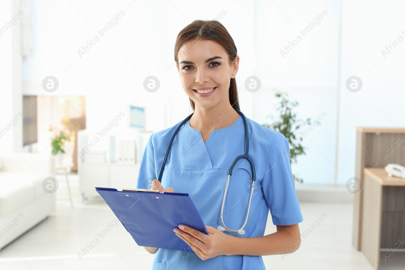 Photo of Female medical assistant in clinic. Health care service