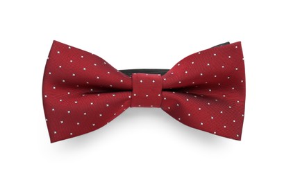 Photo of Stylish burgundy bow tie with polka dot pattern on white background, top view