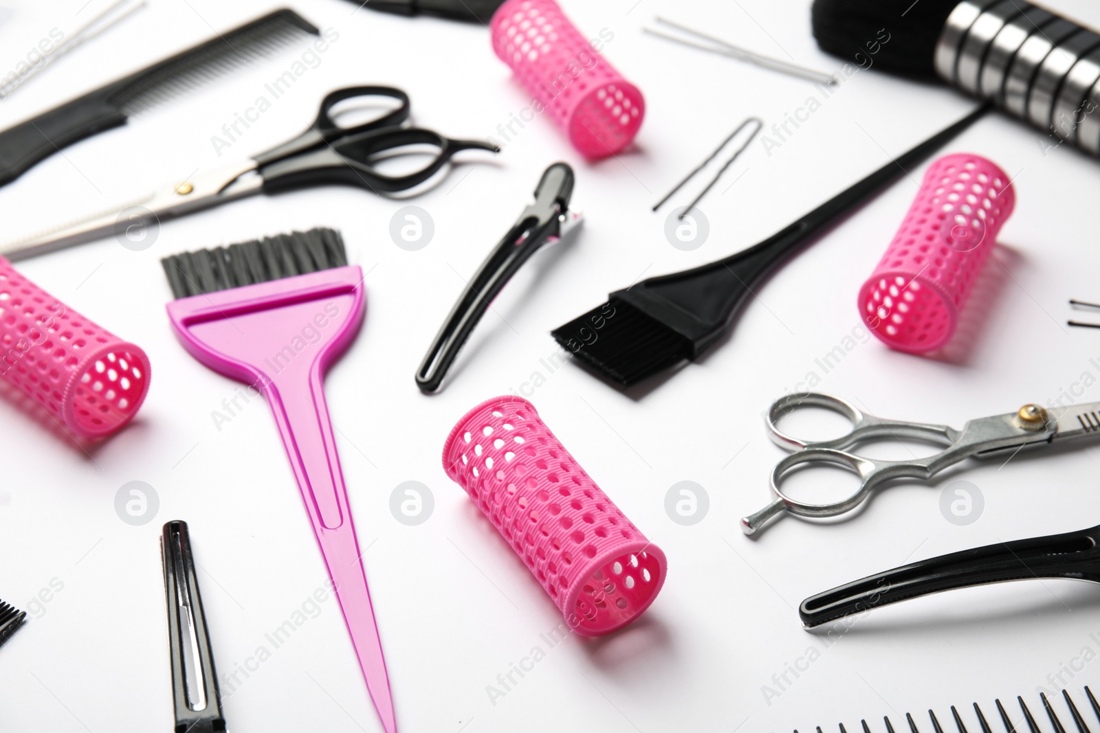 Photo of Professional tools for hair dyeing on white background