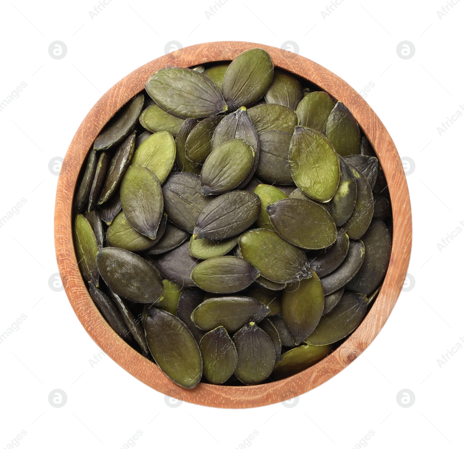 Photo of Wooden bowl with pumpkin seeds isolated on white, top view