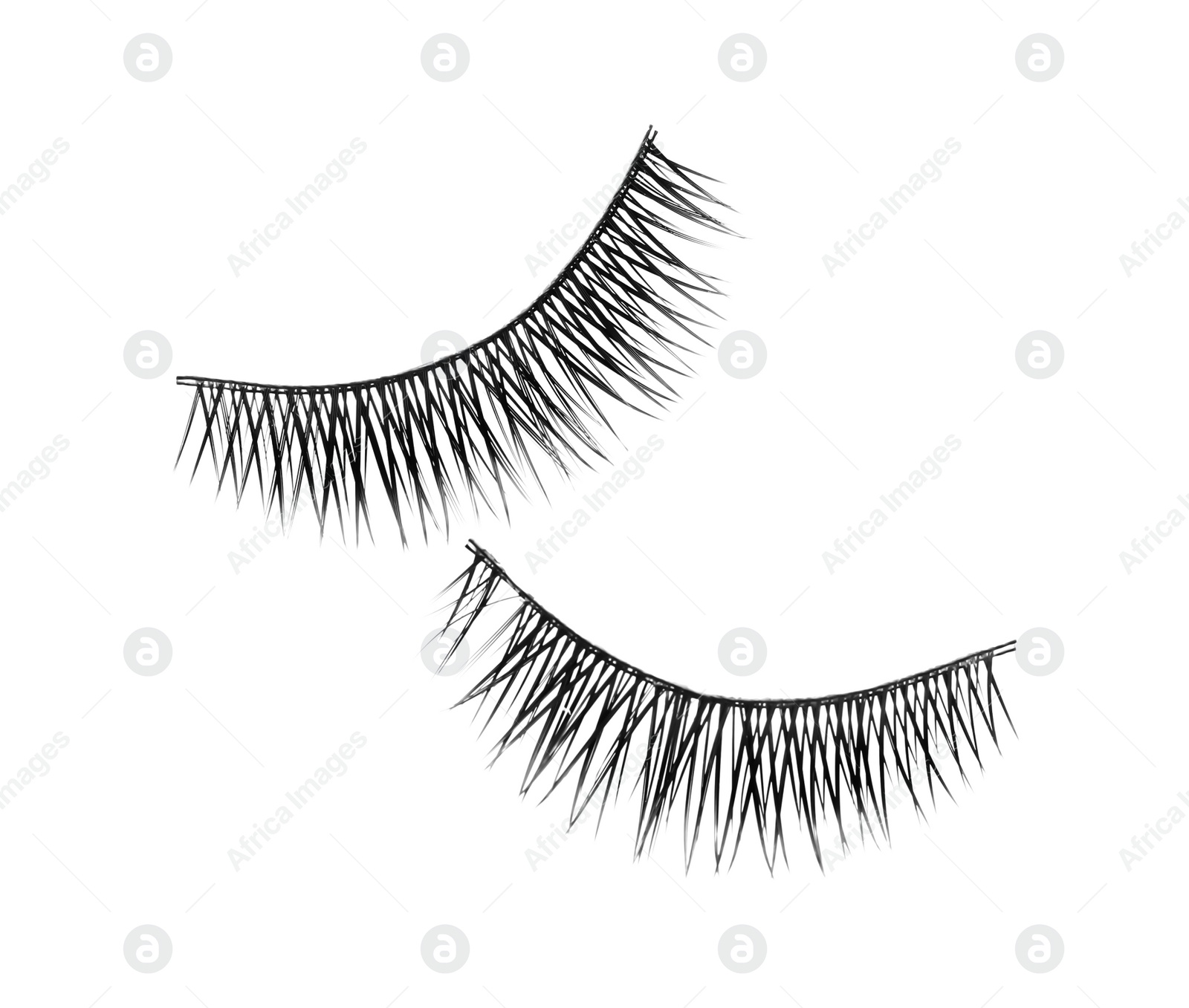 Photo of Fake eyelashes on white background, top view. Makeup product