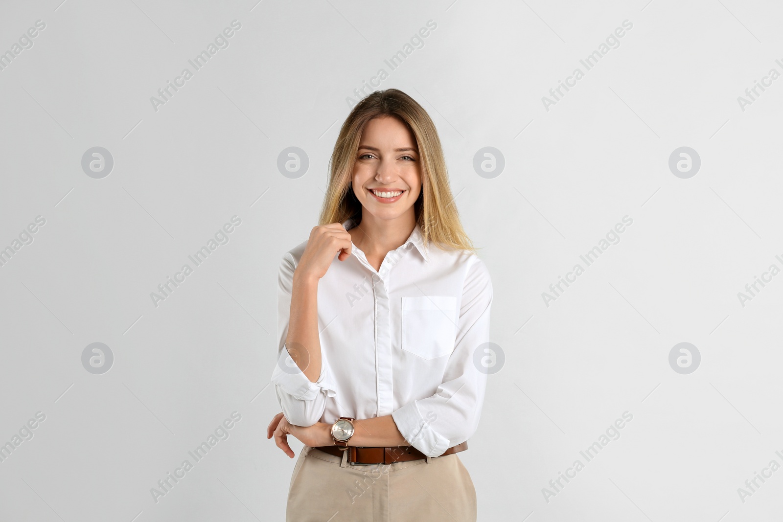 Photo of Portrait of beautiful young businesswoman on white background