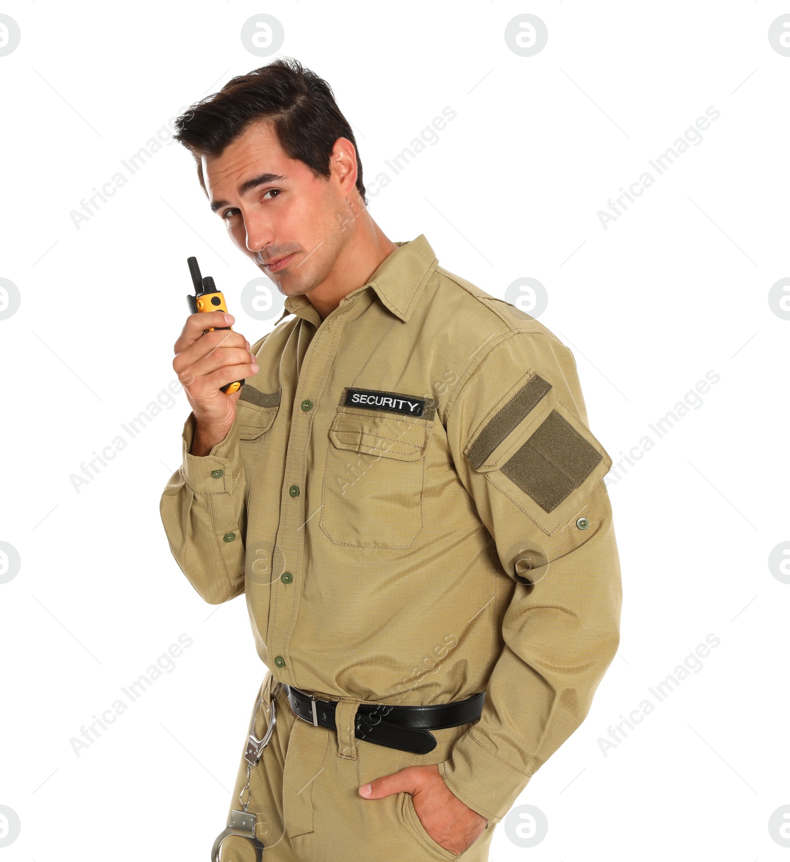 Photo of Male security guard in uniform using portable radio transmitter on white background