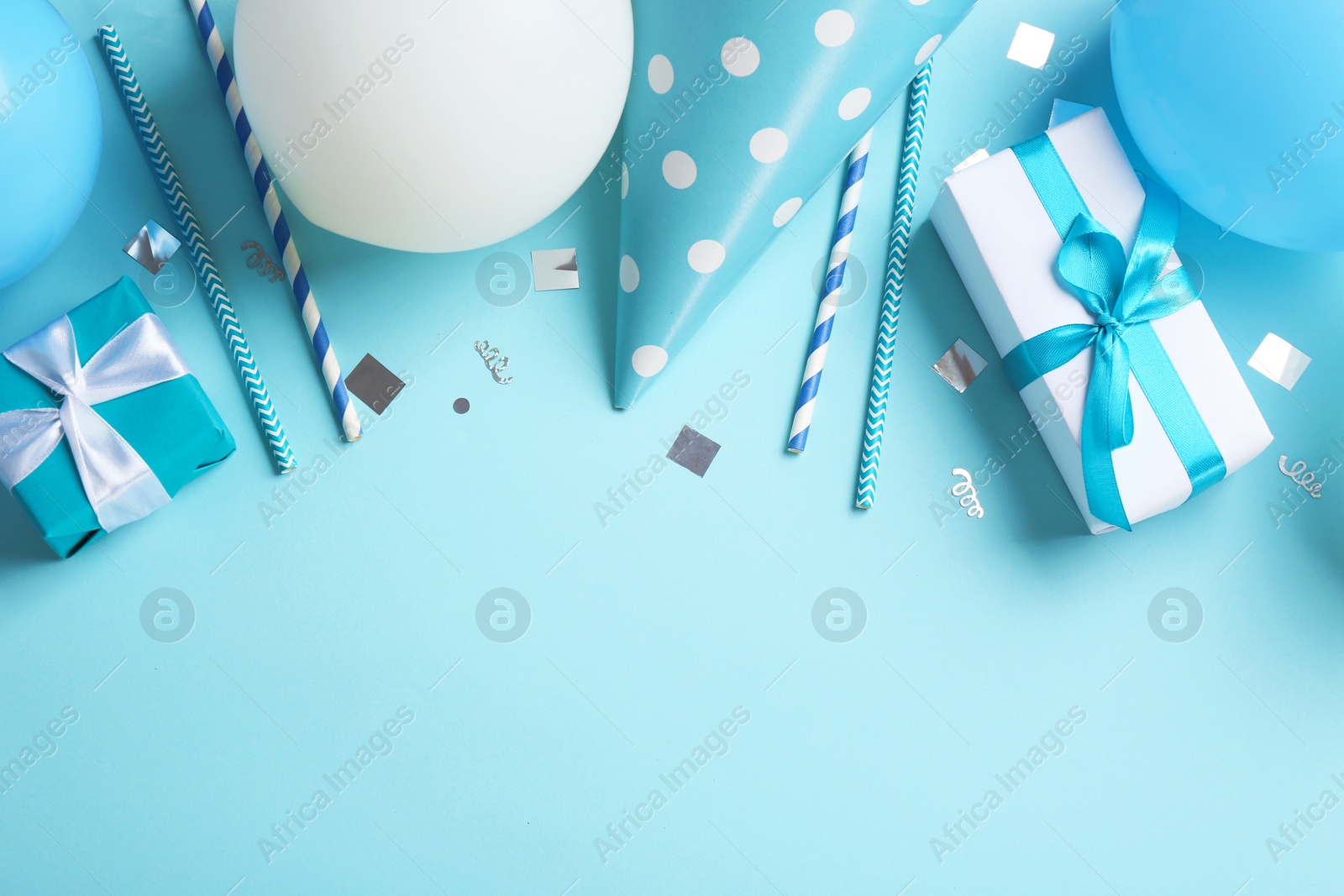 Photo of Flat lay composition with air balloons and space for text on color background