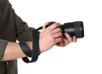 Photo of Photographer holding modern camera on white background, closeup