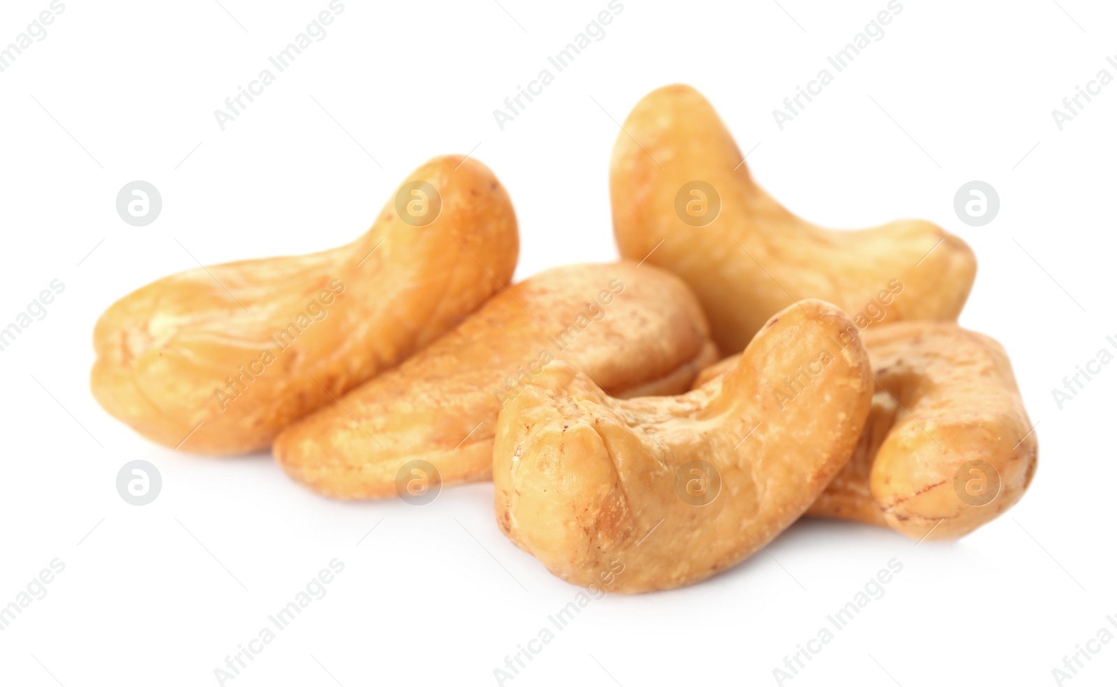 Photo of Pile of tasty organic cashew nuts isolated on white