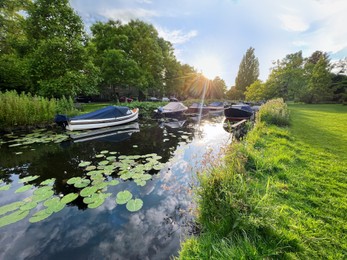 Beautiful view of moored boats in canal on sunny day