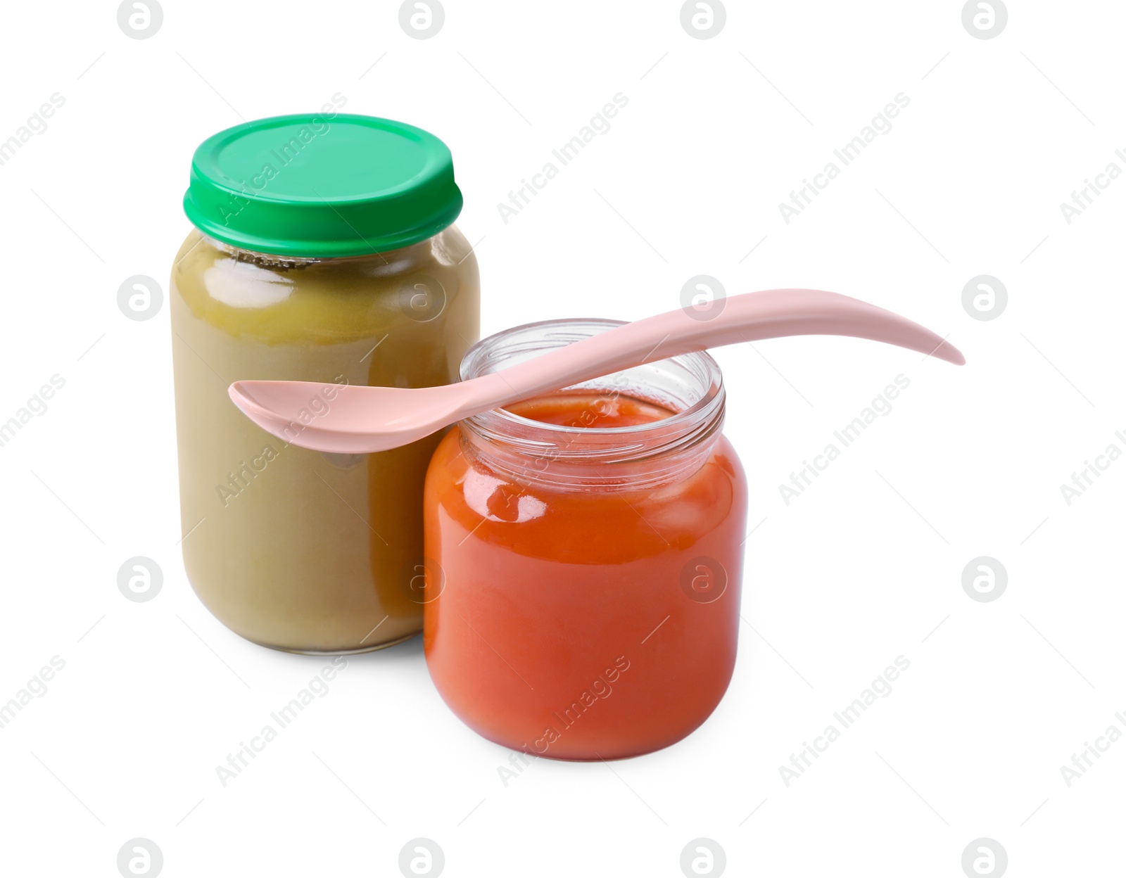 Photo of Glass jars with healthy baby food and spoon isolated on white