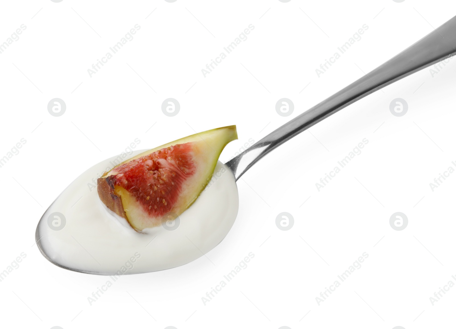 Photo of Spoon with yogurt and fig isolated on white