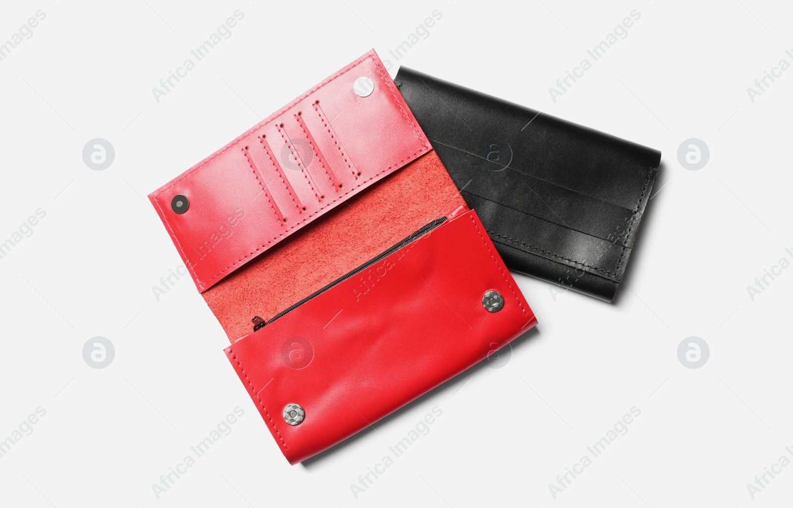 Photo of Stylish leather wallets on white background, top view