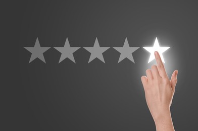 Woman choosing one star out of five on virtual screen, closeup. Customer satisfaction score