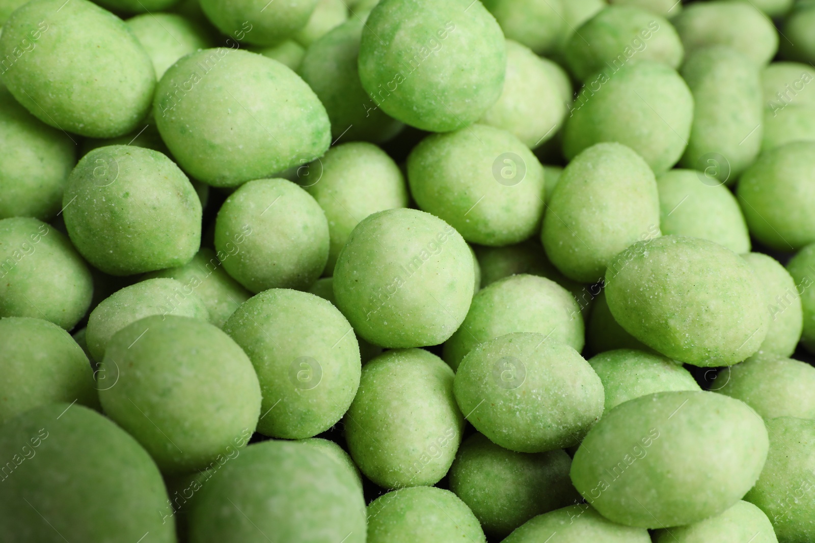 Photo of Tasty wasabi coated peanuts as background, closeup