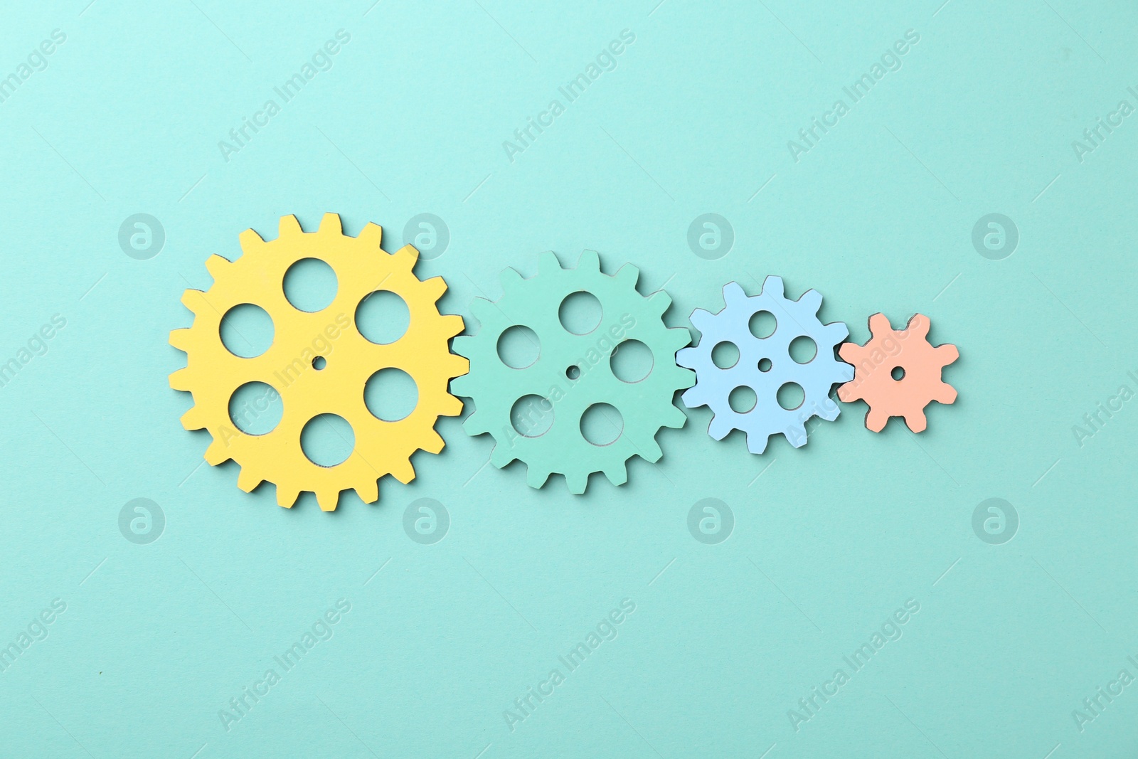 Photo of Business process organization and optimization. Scheme with colorful figures on turquoise background, top view