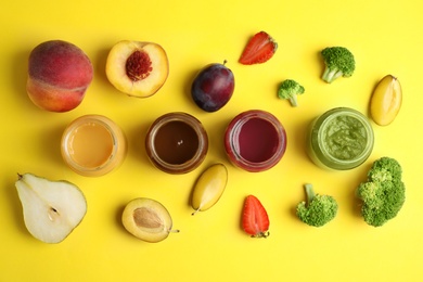 Photo of Flat lay composition with healthy baby food and ingredients on yellow background