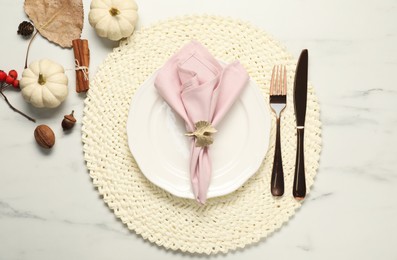 Photo of Stylish autumn table setting on white marble background, flat lay