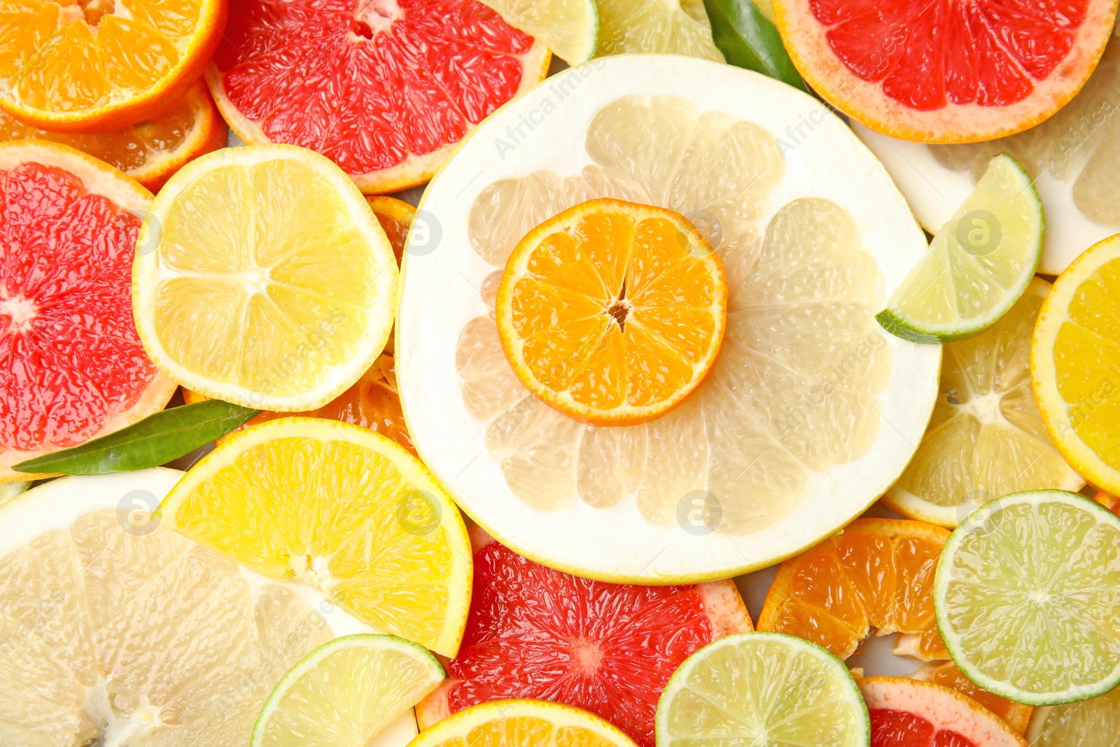 Photo of Different citrus fruits as background, top view