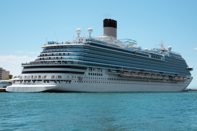 Photo of Modern cruise ship in sea on sunny day