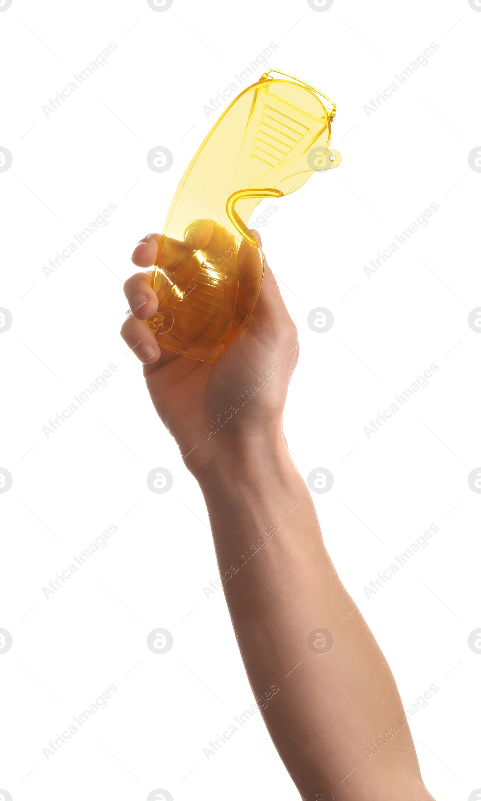 Photo of Construction worker holding protective goggles isolated on white, closeup