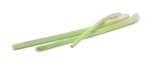 Fresh aromatic lemongrass stalks on white background