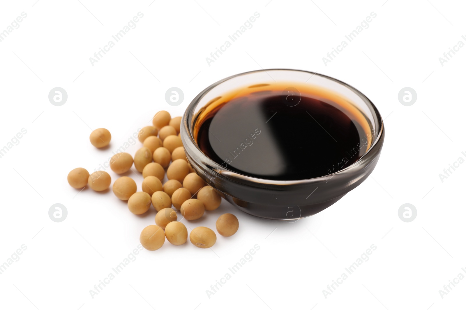 Photo of Bowl of soy sauce and soybeans isolated on white