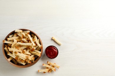 Photo of Delicious hard chucks with ketchup on white wooden table, flat lay. Space for text