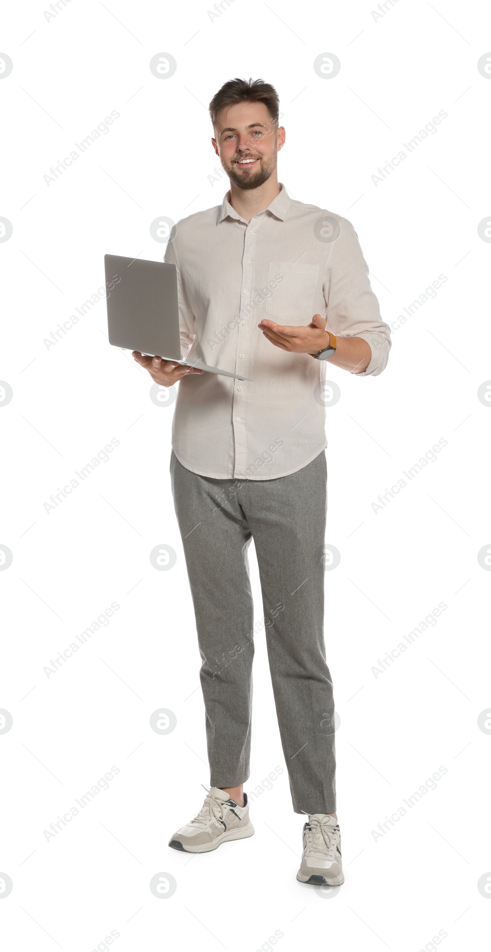 Photo of Handsome man working with laptop on white background