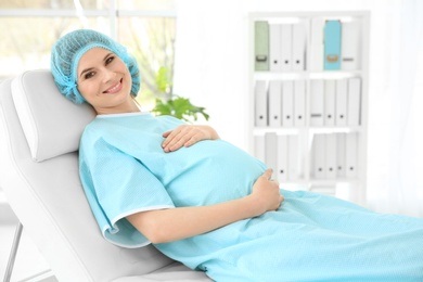 Photo of Gynecology consultation. Pregnant woman in modern clinic