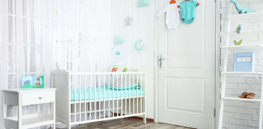 Image of Baby room interior with comfortable crib. Banner design