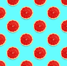 Image of Many fresh ripe slices of grapefruits on turquoise background, flat lay. Seamless pattern design