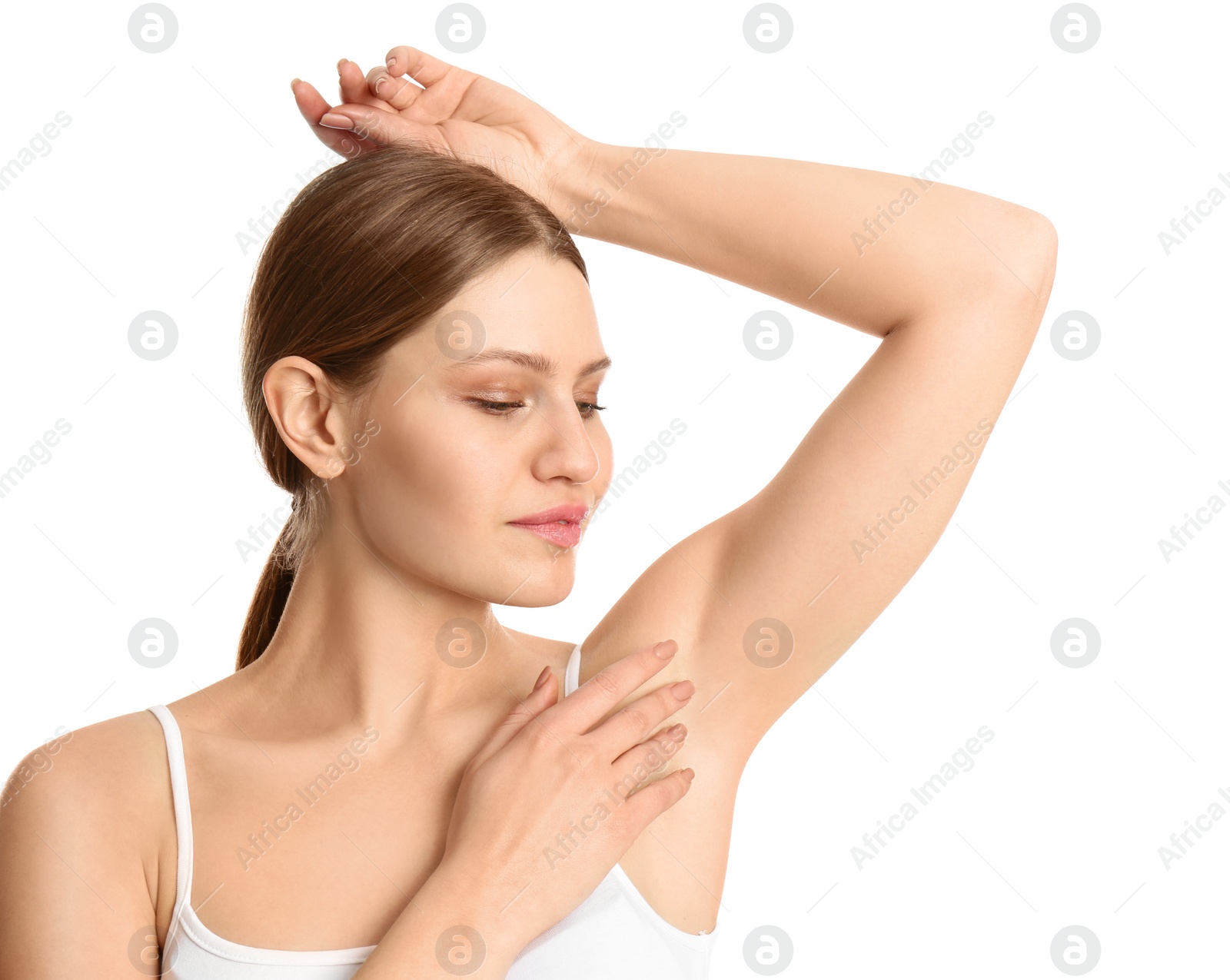 Photo of Young beautiful woman showing armpit with smooth clean skin on white background