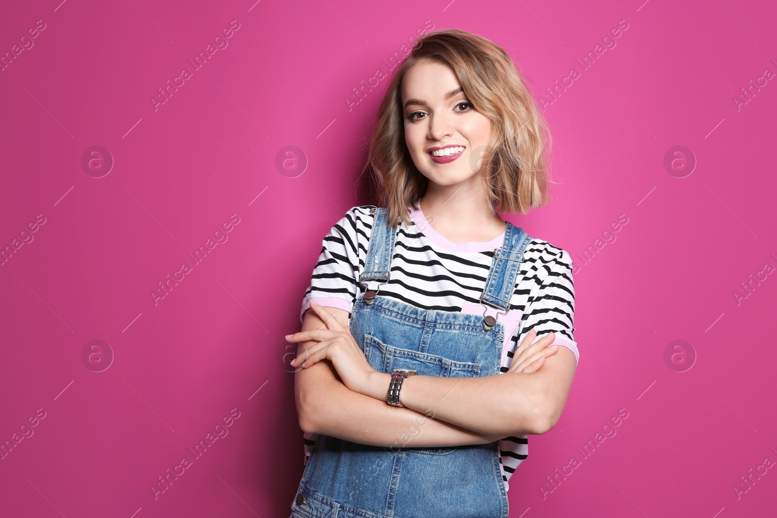 Photo of Beautiful young woman posing on color background